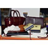 A GROUP OF ASPINAL OF LONDON HANDBAGS AND PURSE, ETC, comprising a claret textured leather bag