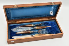 A CASED CARVING SET, to include fish servers, meat fork and carving knife, each fitted with