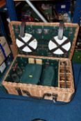A WICKER PICNIC HAMPER/SET, a large hamper containing a set of four wine glasses, four plates,