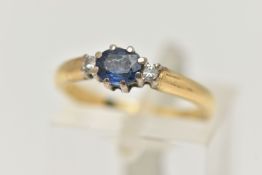 AN 18CT GOLD SAPPHIRE AND DIAMOND THREE STONE RING, centring on an oval cut blue sapphire, claw