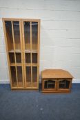 A MODERN BEECH FINISH TWO DOOR BOOKCASE, length 81cm x depth 39cm x height 190cm along with a pine