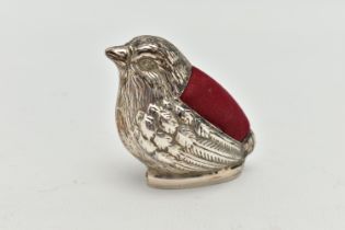 A WHITE METAL BIRD PIN CUSHION, a small pin cushion designed as a small garden bird, possibly a