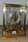 A GLASS CASED VICTORIAN BRASS FUSEE SKELETON CLOCK, the arch shaped clock with silvered chapter ring