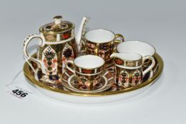 A MINIATURE ROYAL CROWN DERBY IMARI 1128 TEA SET AND SERVING TRAY, comprising an oval serving