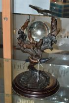 A BRONZE FRANKLIN MINT SCULPTURE 'GUARDIANS OF THE WORLD' CRYSTAL BALL, by Steven Lord, a central