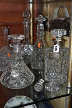 A GROUP OF DECANTERS AND STOPPERS, comprising a square decanter with silver collar, hallmarked