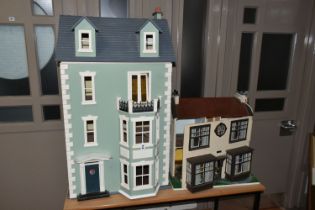 TWO DOLL'S HOUSES, comprising a large Georgian kit built house, partially decorated, and a mid