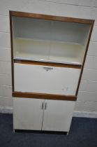 A 20TH CENTURY FORTRESS KITCHEN CABINET, fitted with double sliding glazed doors, a fall front