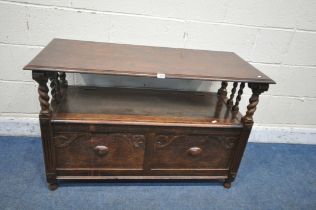 A 20TH CENTURY OAK MONKS BENCH, with a rise and fall back rest/surface, raised on barley twist