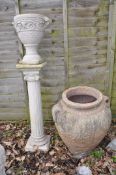 TWO MODERN COMPOSITE GARDEN URNS the smaller being 36cm high standing on a column total height 119cm