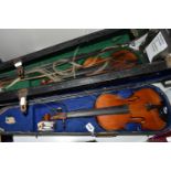 TWO LATE 19TH CENTURY CASED VIOLINS, comprising violin needing attention, one piece back, a