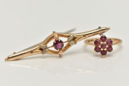 A 9CT GOLD BROOCH AND RING, a principally set round cut garnet, prong set in yellow gold, foliage