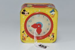 A CHAD VALLEY WALT DISNEY PRODUCTIONS MONEY BOX, the tin with toy clock with movable hands on one