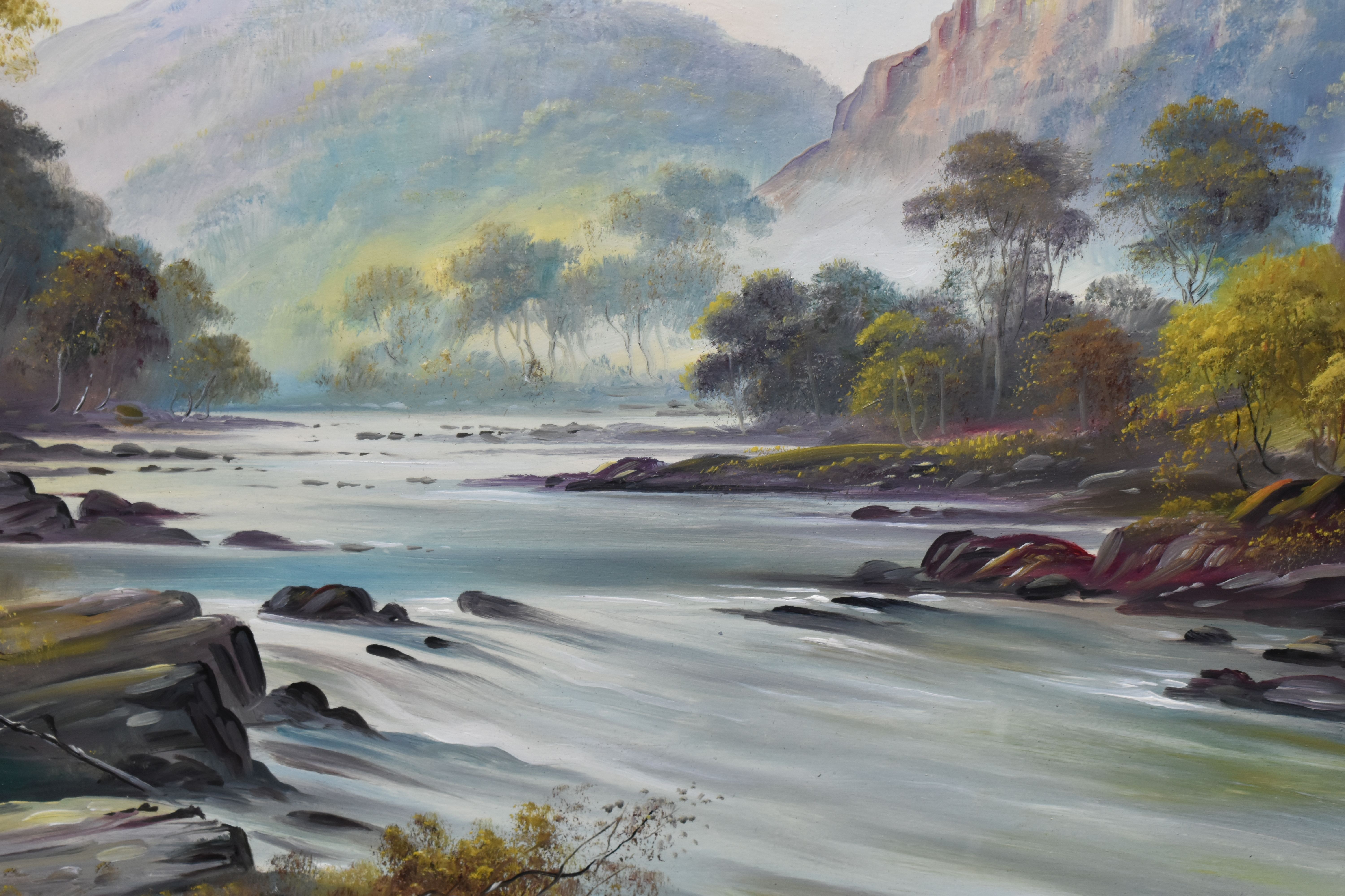 GEORGE WILLIS PRYCE (1866-1949) A RIVER LANDSCAPE, a river flows over rocks to the foreground with - Image 2 of 4