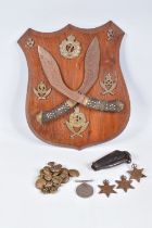 A GURKHA REGIMENT WOODEN SHIELD, to include military buttons and a jack knife, the shield features