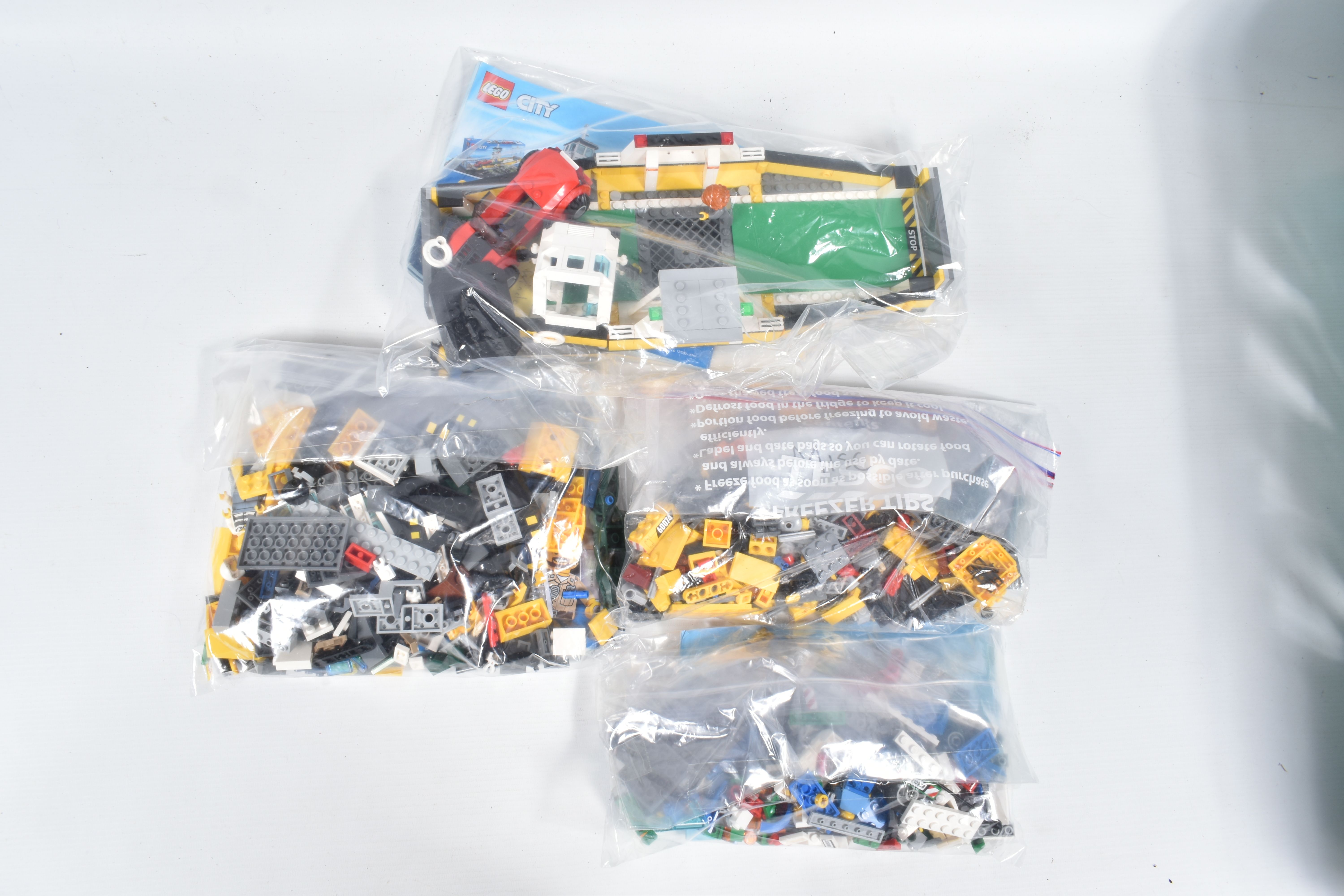A COLLECTION OF ELEVEN UNBOXED LEGO CITY MODELS, each individually sealed with some models built, - Image 7 of 7