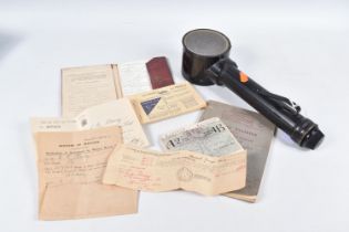 A MILITARY ILLUMINATING MAP READER, a training manual, ration book and various original documents