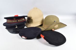 A COLLECTIONS OF MODERN MILITARY HATS, these include an Australian slouch hat, a modern Pith