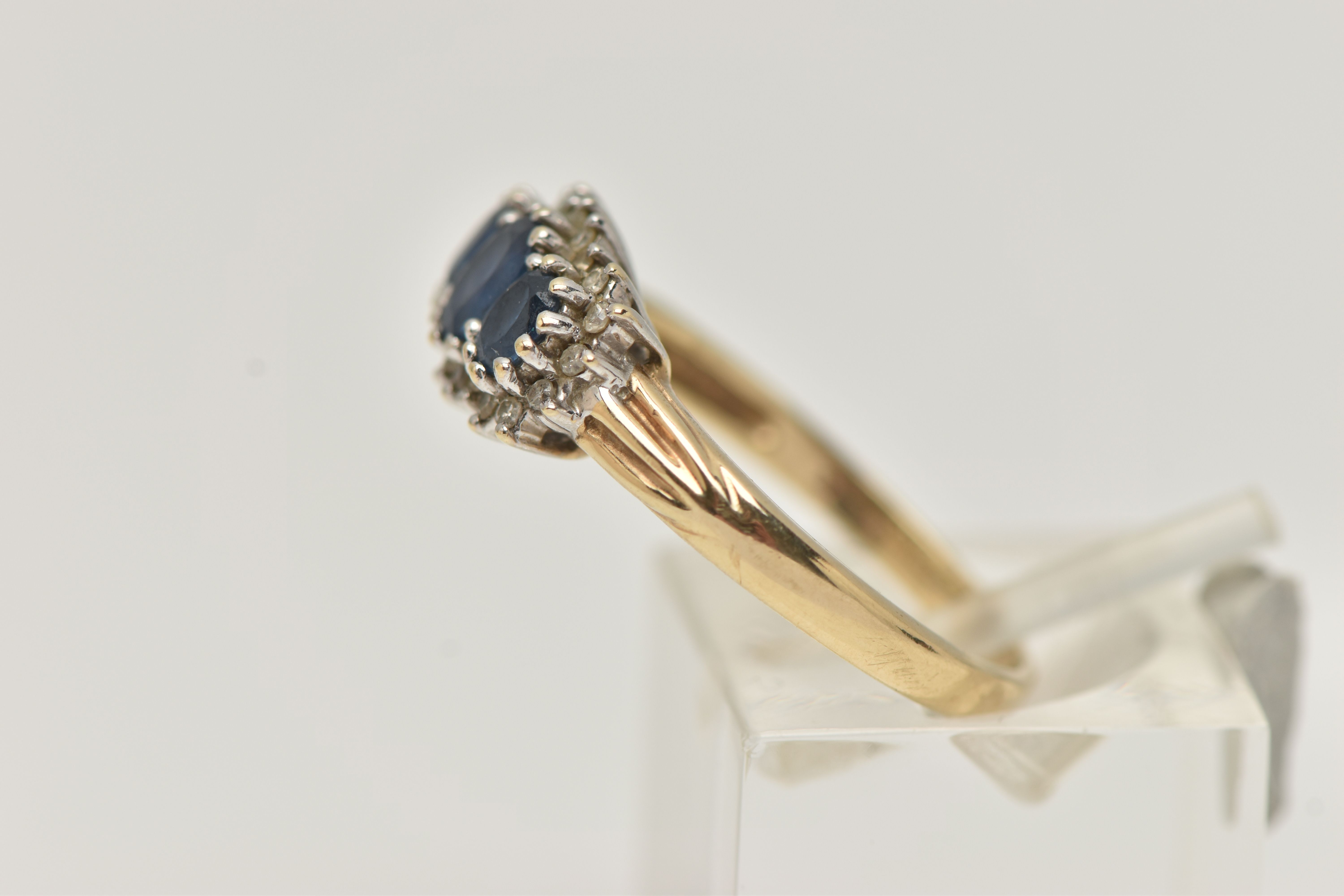 A 9CT GOLD SAPPHIRE AND DIAMOND RING, designed as three graduated oval sapphires within a single cut - Image 2 of 4
