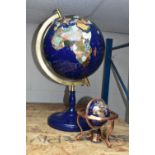 TWO MODERN HARDSTONE EFFECT TERRESTRIAL GLOBES, one on a blue plinth, approx. height 65cm, the other