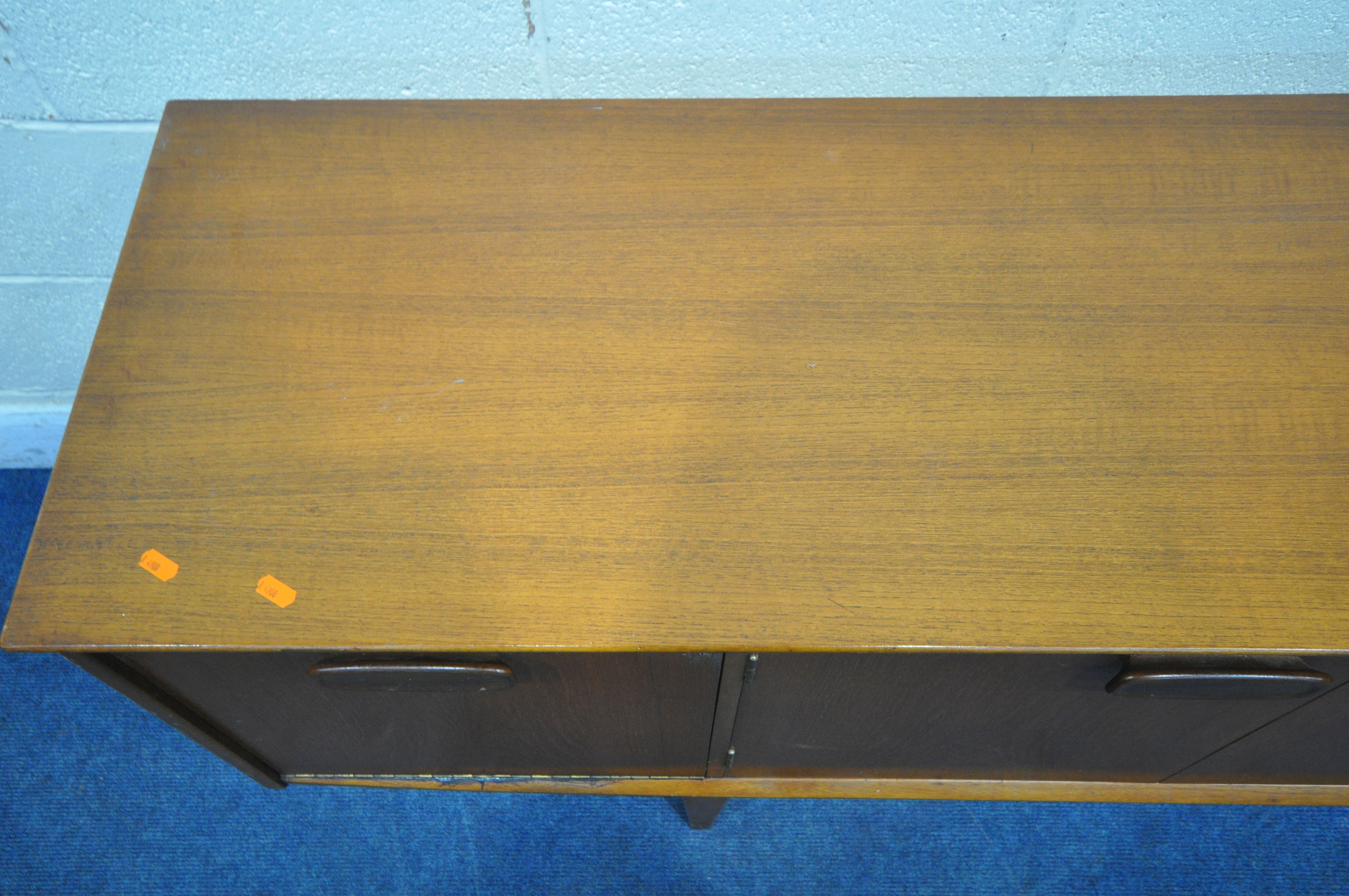 A MID CENTURY JENTIQUE TEAK SIDEBOARD, with three drawers, two cupboard doors and a fall front door, - Image 2 of 6