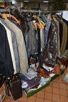 A QUANTITY OF LADIES AND GENTS CLOTHING, SUITCASES, BEDDING AND CLOTHING ACCESSORIES, the majority