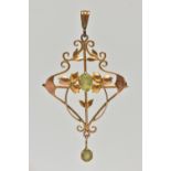A YELLOW METAL PERIDOT SET LAVALIER PENDANT, open work floral pattern, set with a central oval cut