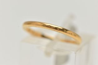 A YELLOW METAL BAND RING, a thin band ring with patterned side profiles, approximate width 1.5mm x