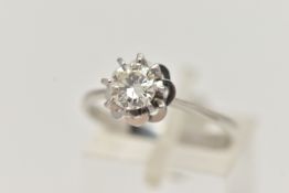 A SINGLE STONE DIAMOND RING, the brilliant cut diamond in an eight claw setting with fancy looped