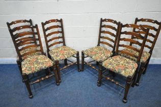 A SET OF SIX OAK LADDER BACK CHAIRS, with beige and floral upholstery, on turned legs and stretchers