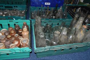 FIVE CRATES OF VINTAGE GLASS BOTTLES AND STONEWARE, to include a collection of over one hundred