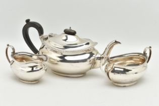 A MID 20TH CENTURY, THREE PIECE SILVER TEA SET, comprising of a teapot, fitted with an ebonised