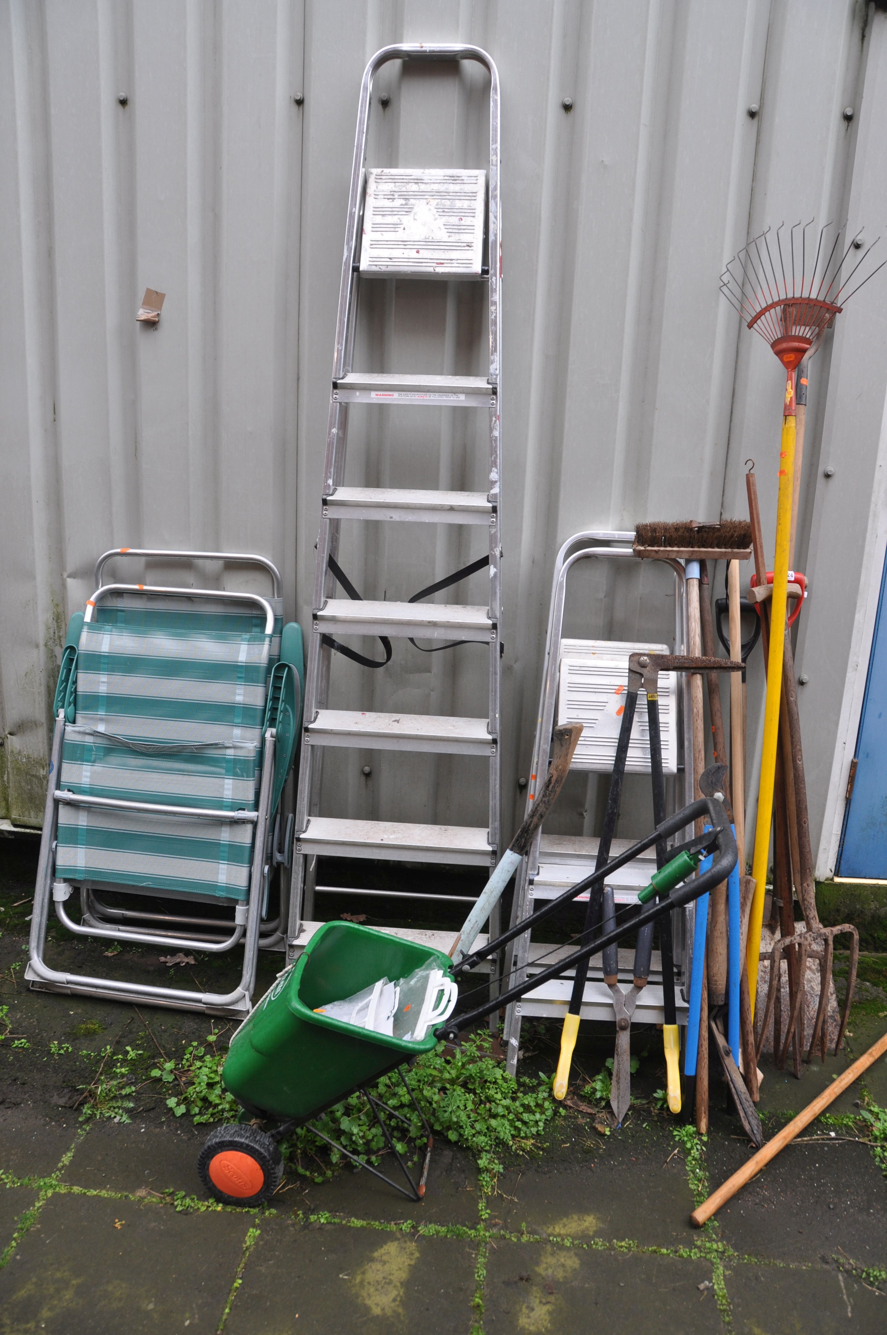 THREE ALUMINIUM STEP LADDERS, two folding garden chairs and a selection of garden tools