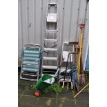 THREE ALUMINIUM STEP LADDERS, two folding garden chairs and a selection of garden tools