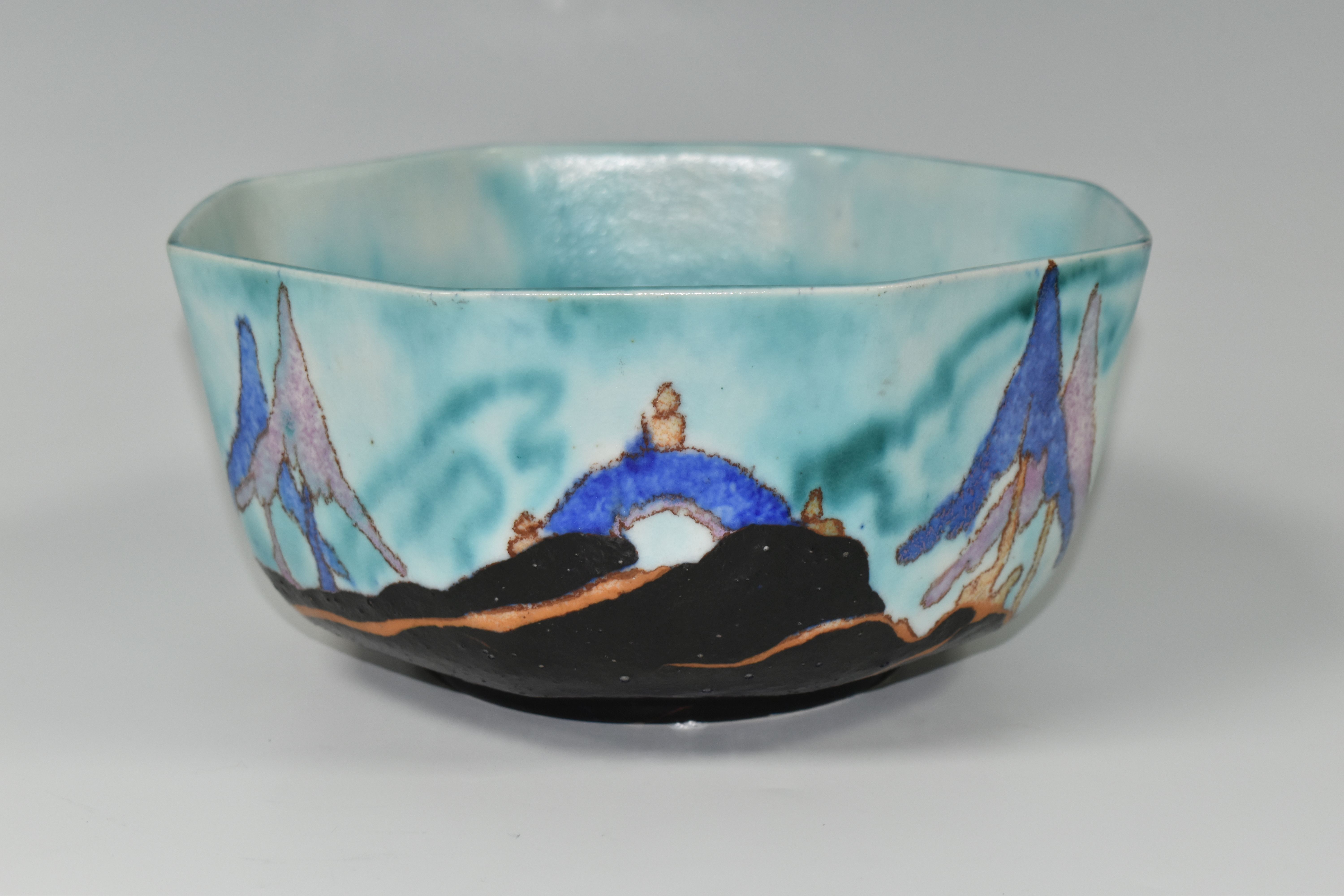 A CLARICE CLIFF INSPIRATION - CAPRICE BOWL, the octagonal bowl decorated with a stylised landscape