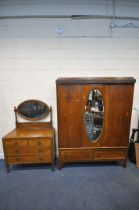 A 20TH CENTURY OAK TWO PIECE BEDROOM SUITE, comprising a single mirror door wardrobe, with two