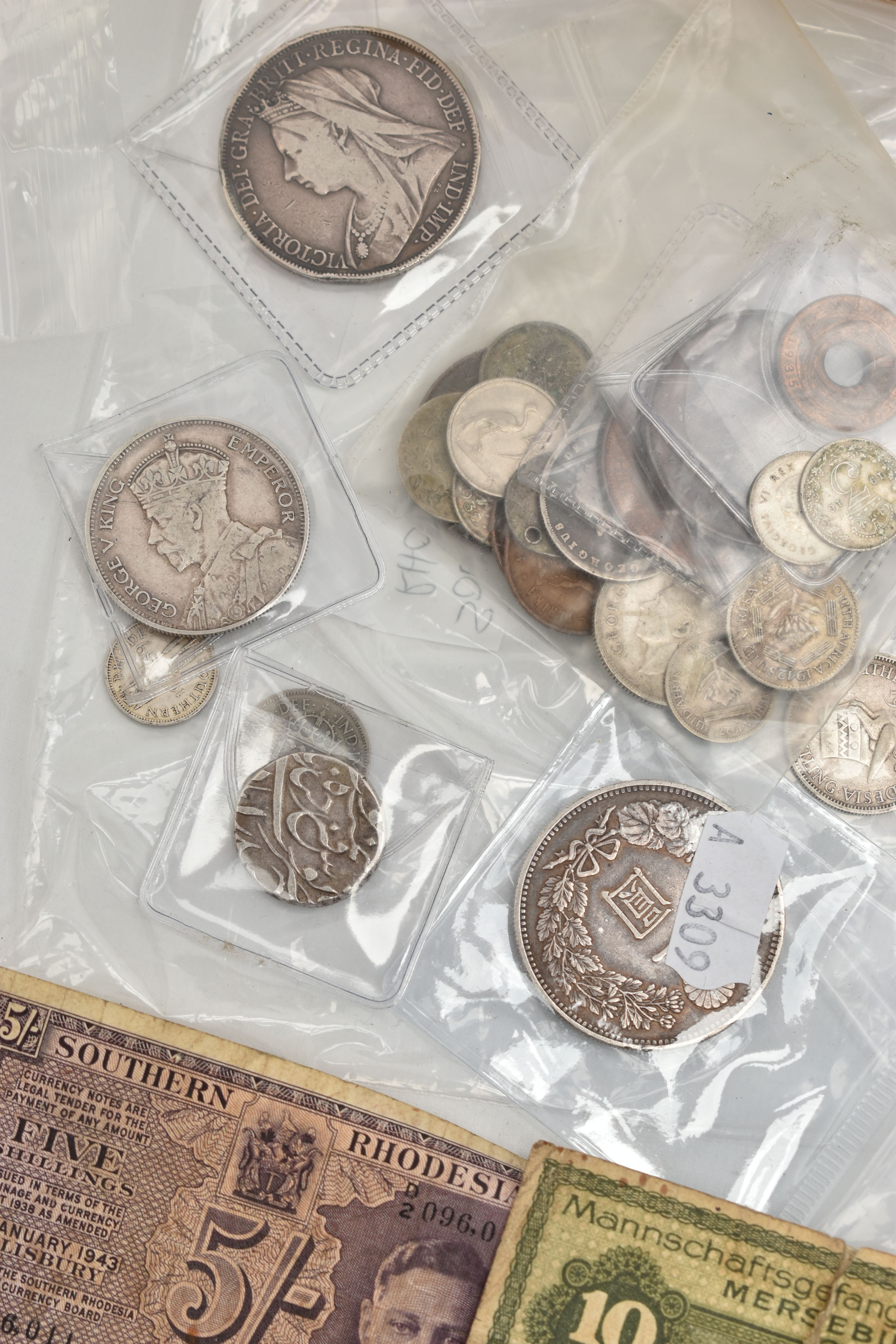 A TIN CONTAINING MIXED WORLD COINS, to include 1890s Japan One Yen, Silver Rupee Hyderabad, 1900 - Image 2 of 8