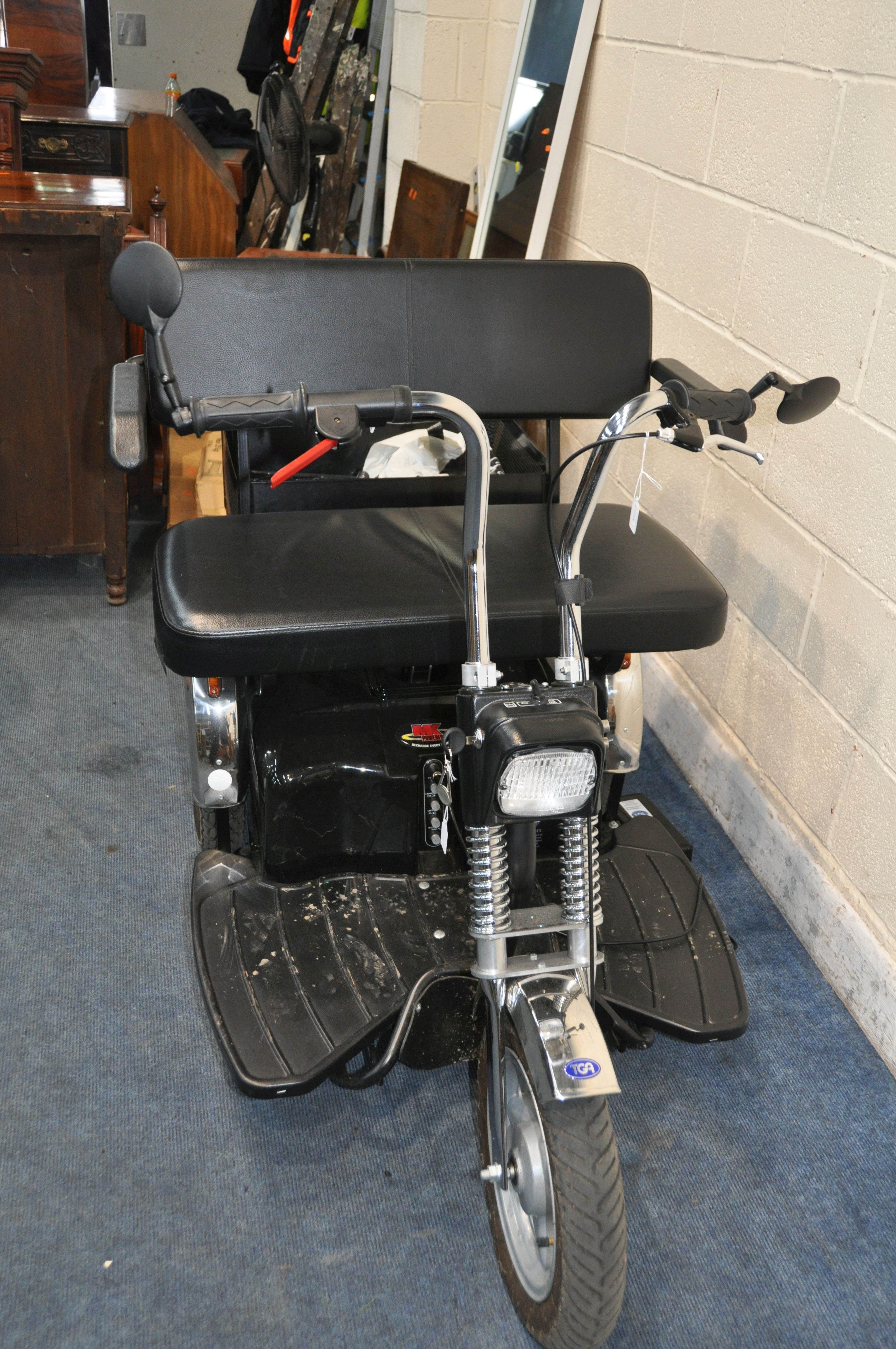 AN AFIKIM TWO SEAT TRICYCLE MOBILITY SCOOTER with charger, one key, rear basket, lights and - Image 2 of 4