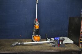 A DYSON DC35 CORDLESS HANDHELD VACUUM CLEANER with hanging bracket, charger and accessory bag