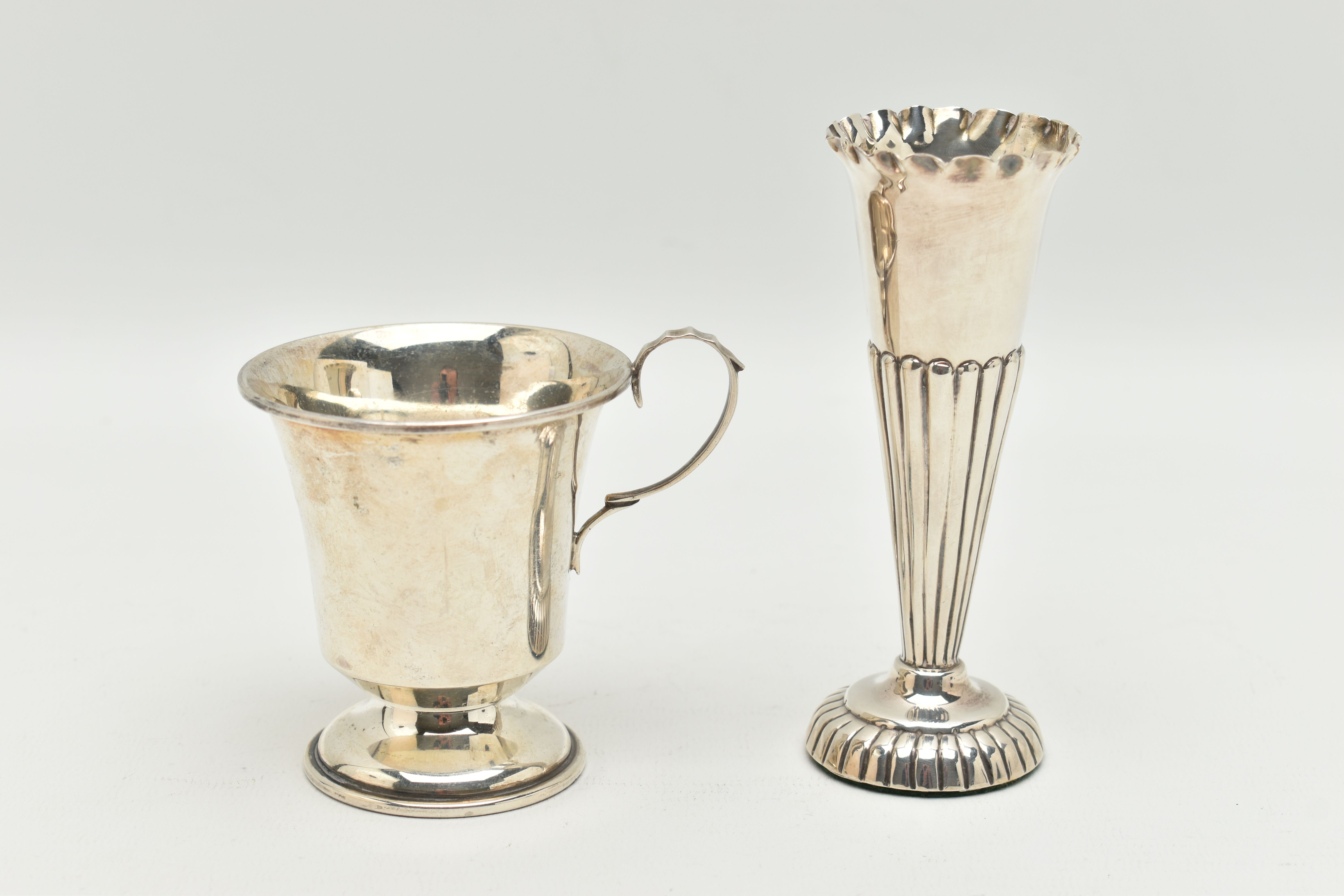 TWO ITEMS OF SILVER, to include a tapered stop reeded pattern posy vase, on a round weighted base,