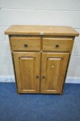 A SOLID OAK CABINET, fitted with two drawers, above two cupboard doors, width 84cm x depth 35cm x