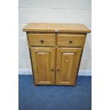 A SOLID OAK CABINET, fitted with two drawers, above two cupboard doors, width 84cm x depth 35cm x