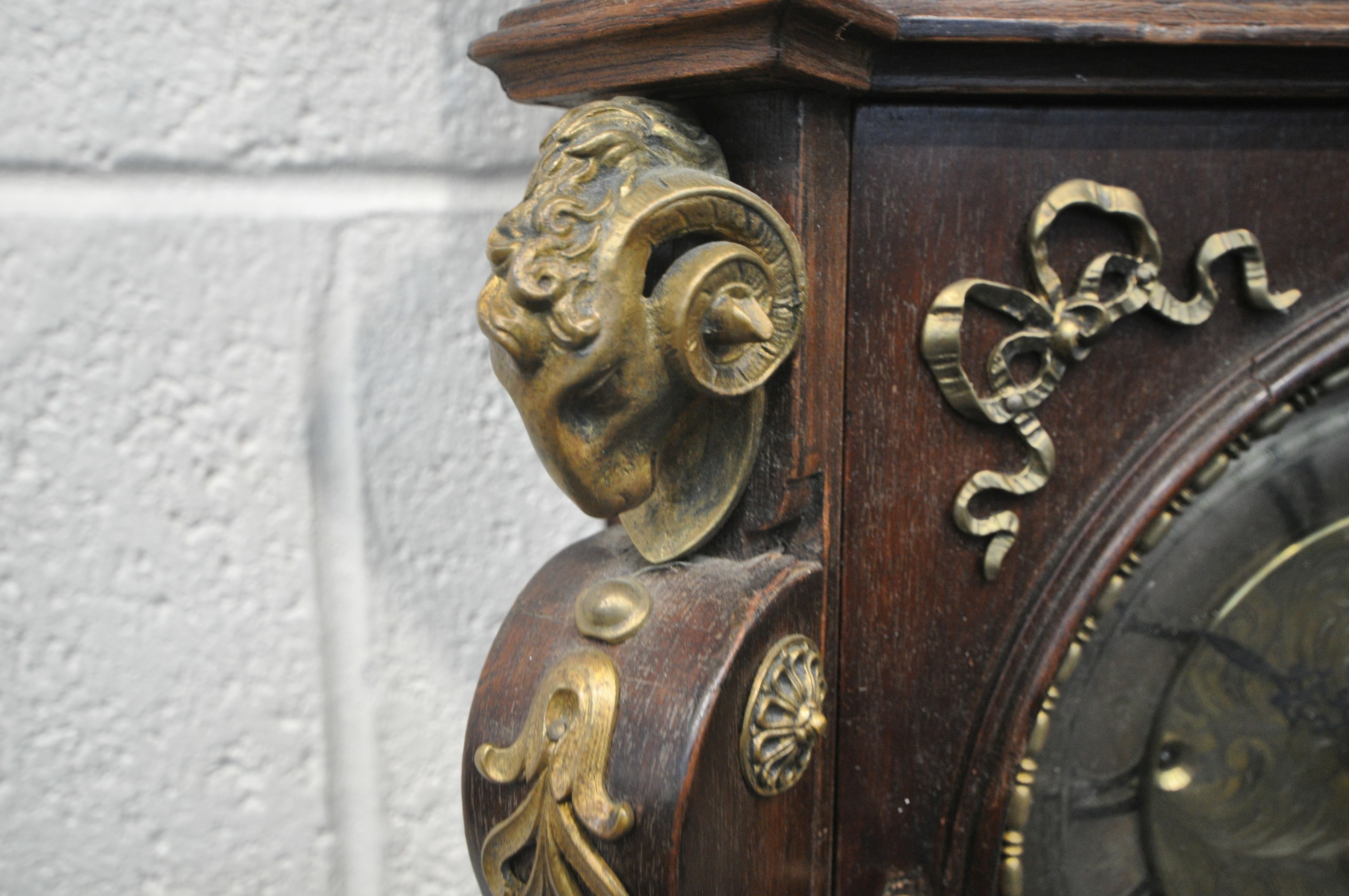 A 20TH CENTURY OAK CASED WALL CLOCK, with a variety of brass decorations, to include masks, ribbons, - Image 4 of 11