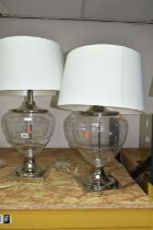 TWO MODERN TABLE LAMPS, with glass bodies and cream shades, height to top of fitting approximately