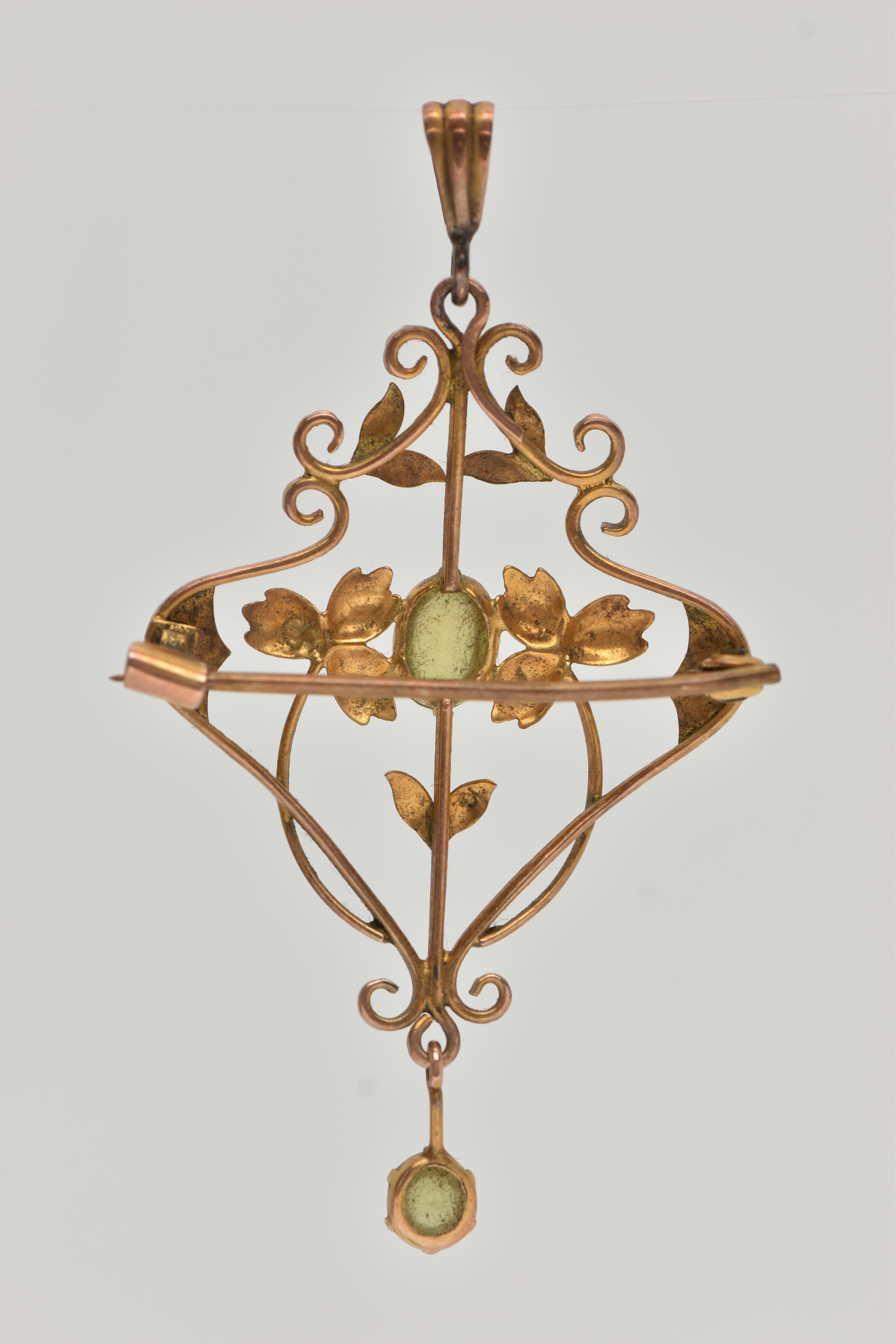 A YELLOW METAL PERIDOT SET LAVALIER PENDANT, open work floral pattern, set with a central oval cut - Image 3 of 3