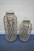 TWO RATTAN WOVEN LANTERNS, with rope handles, largest height 92cm (condition report: overall good