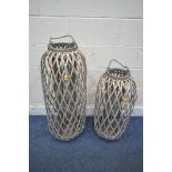 TWO RATTAN WOVEN LANTERNS, with rope handles, largest height 92cm (condition report: overall good