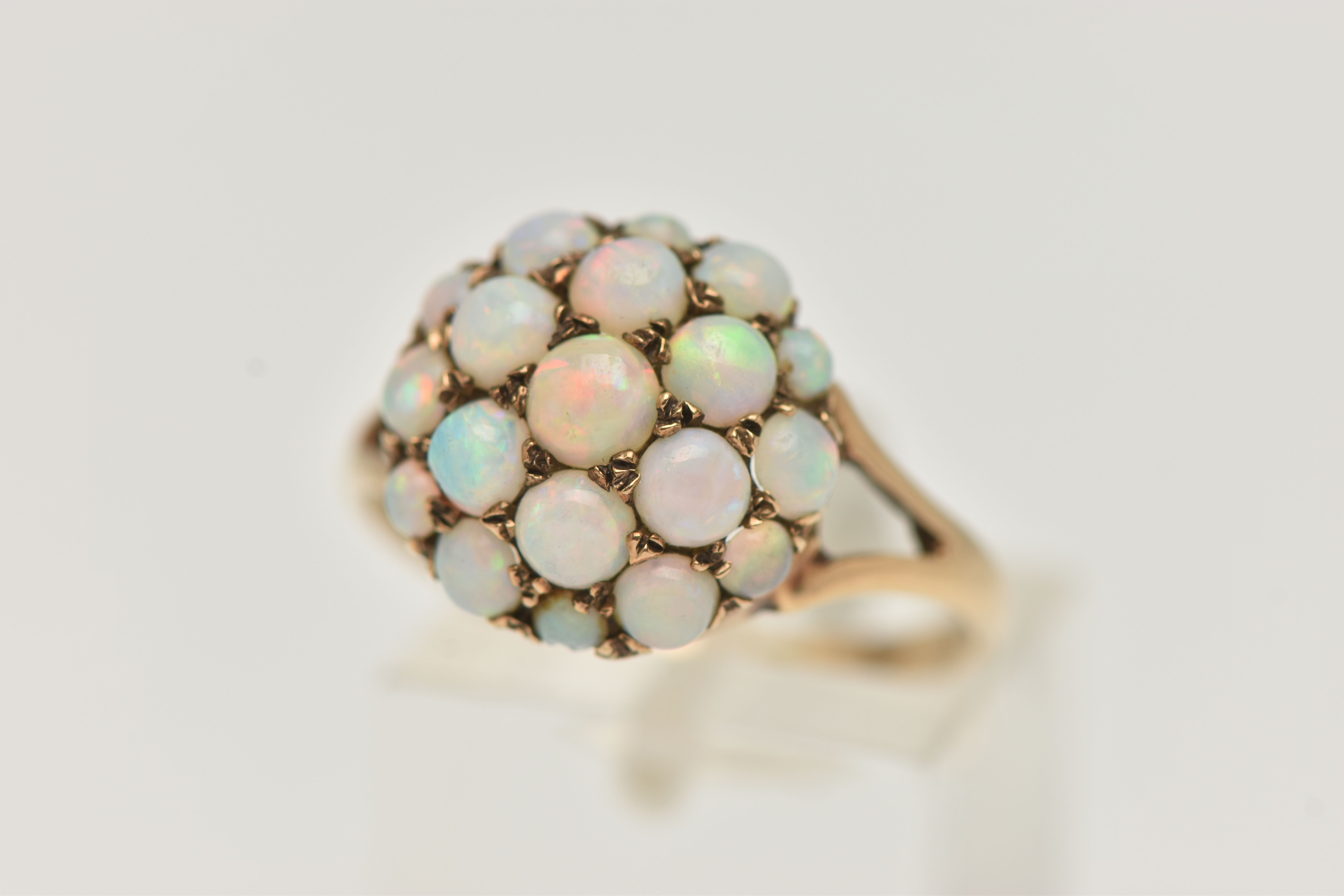 A 9CT GOLD OPAL CABOCHON DOME RING, circular dome set with circular cut opal cabochons,