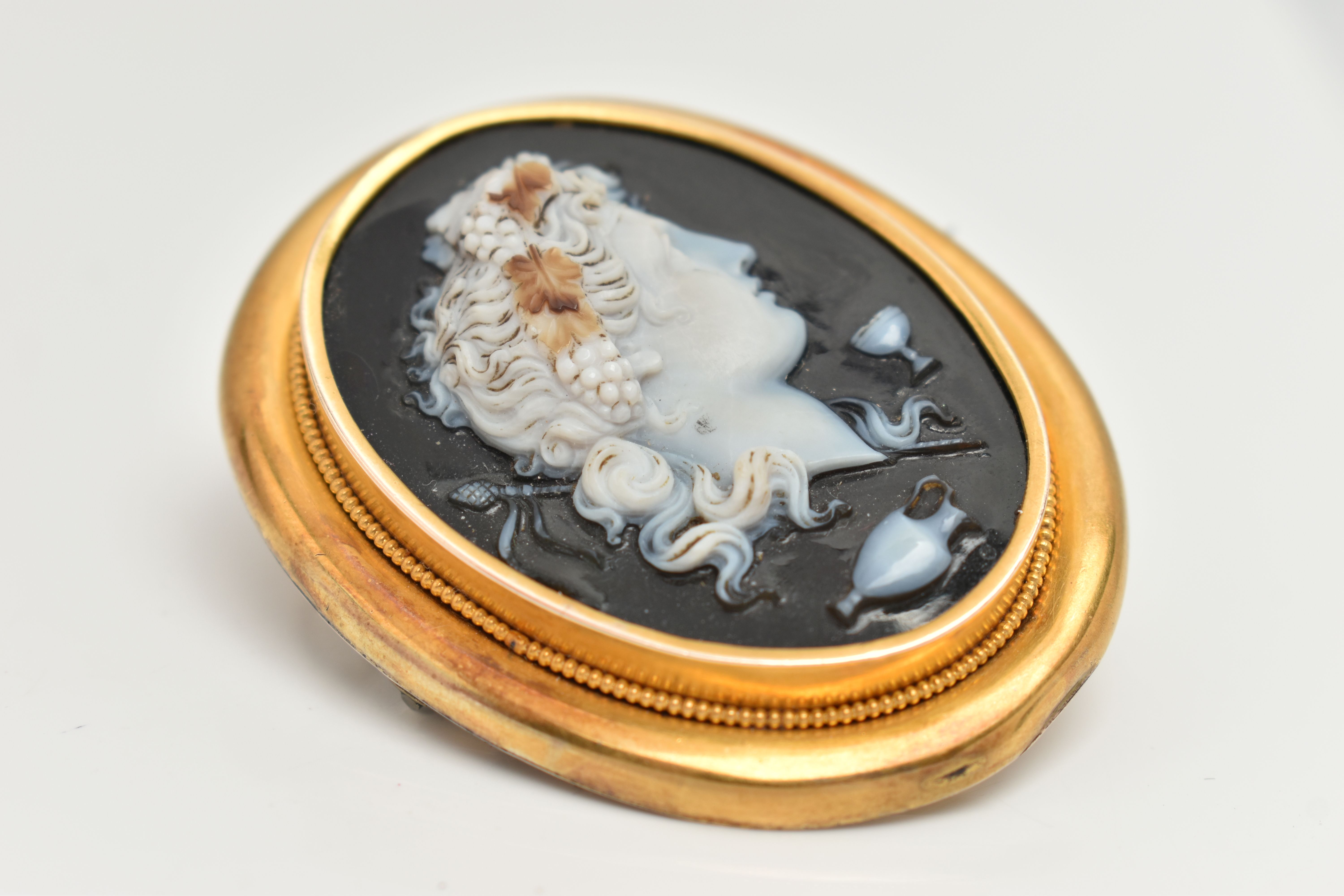 A LARGE YELLOW METAL CAMEO BROOH, glass cameo depicting a lady in profile with grapes in hair, - Image 4 of 4