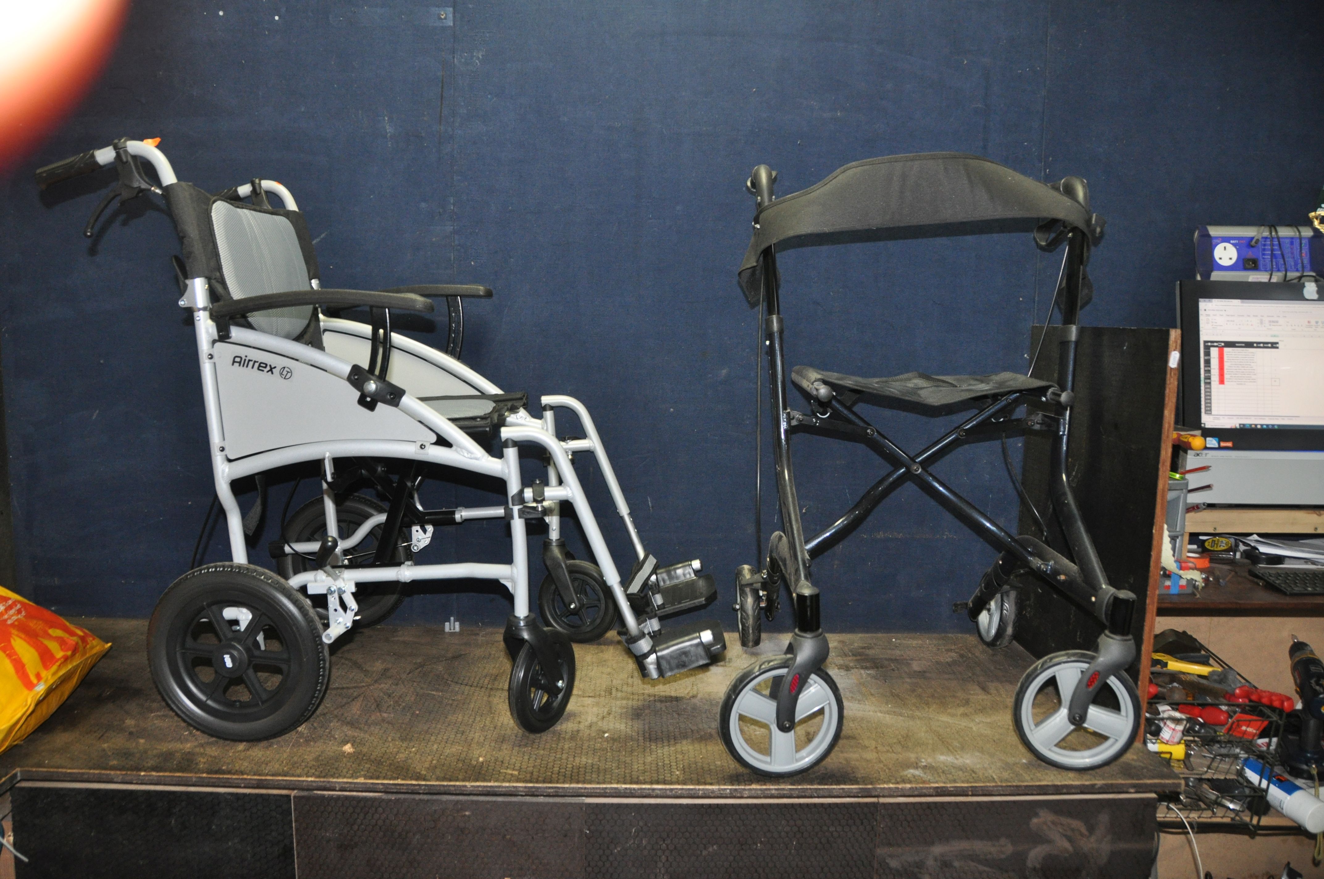 AN AIREX LT LIGHTWEIGHT FOLDING WHEEL CHAIR with two footrests and an unbranded travelator (2)